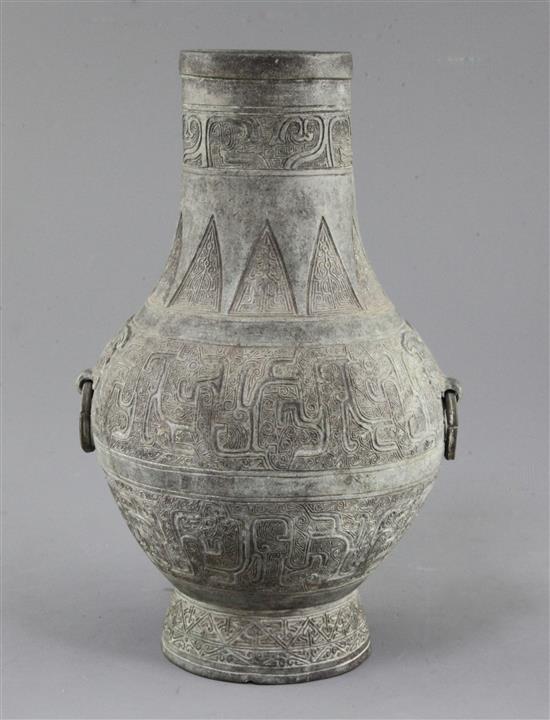 A Chinese archaic bronze ritual wine vessel, Hu, Eastern Zhou dynasty, 5th-3rd century B.C., 24cm high, small hole